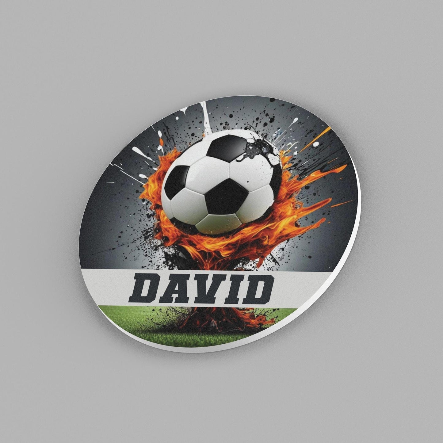 a round sign of a soccer ball with flames around it. The name 'David' across it.