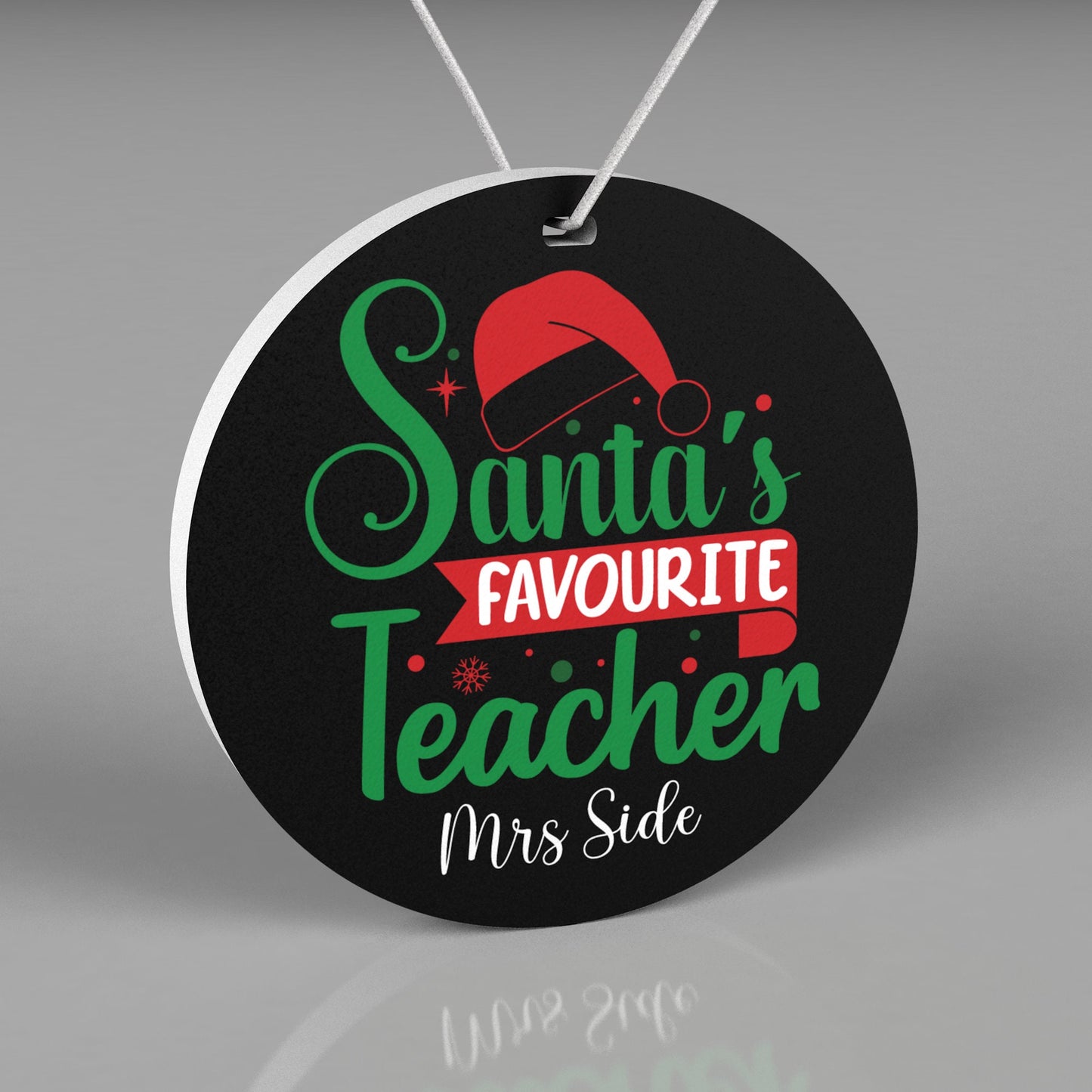 Round Personalized Christmas Ornament in black, red and green. Saying Santa's Favourite Teacher with teachers name