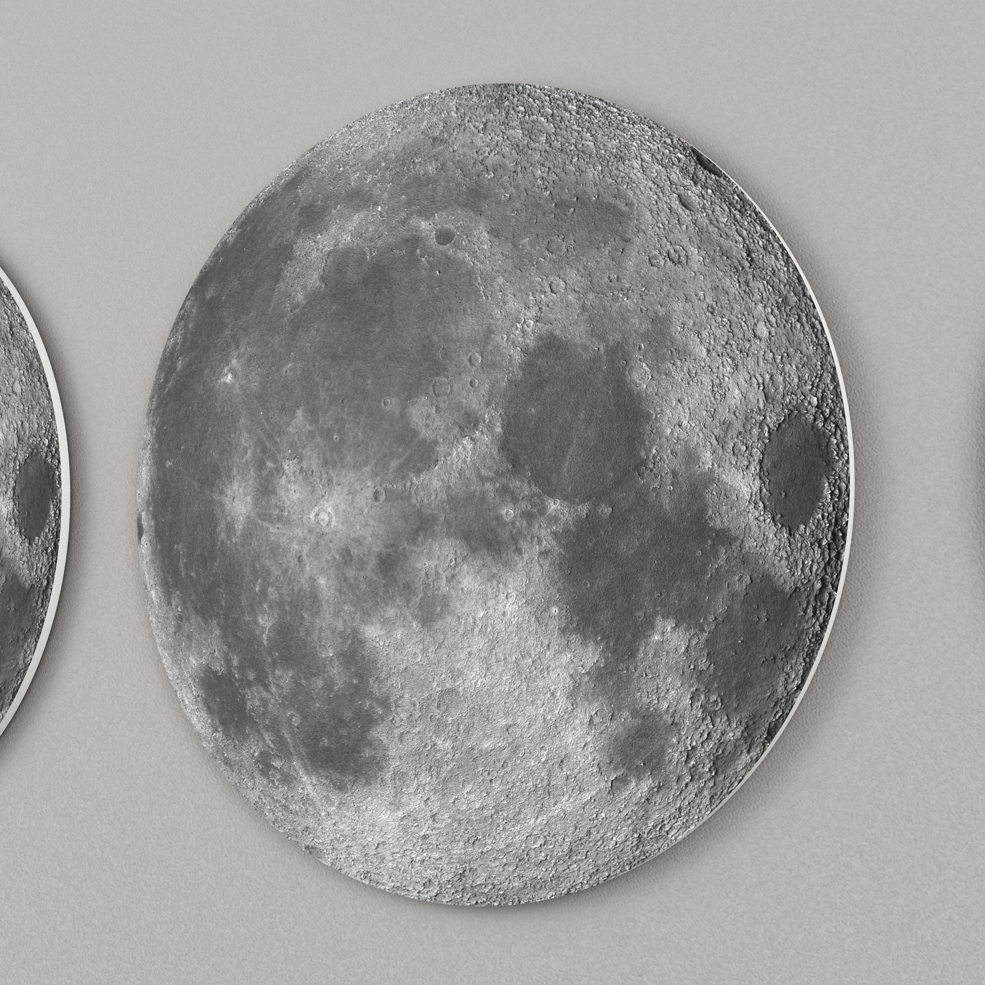 lose-up of moon phase wall decor showing detailed lunar surface and layered 3D design